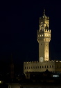 The Clock Tower of the Palazzo Vecchio Florence illuminated against the night sky