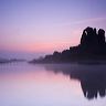 Sunrise over Ogmore Castle on a calm misty spring morning.